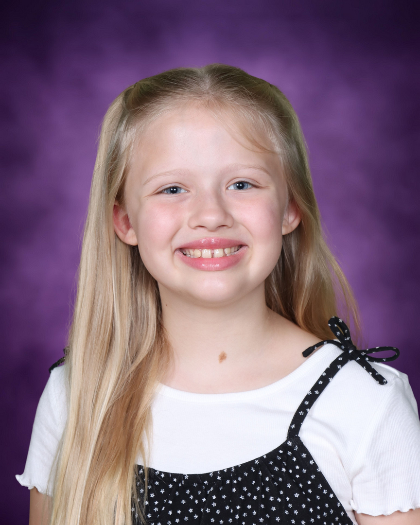 School portrait — girl with purple backdrop